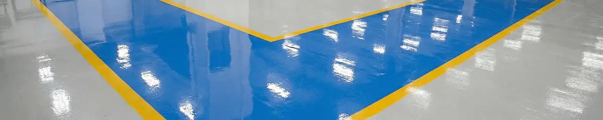A factory floor professionally covered and marked with epoxy flooring in Long Beach, CA