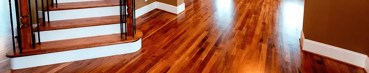 Base floor of a staircase with professionally restored wood flooring in Long Beach CA