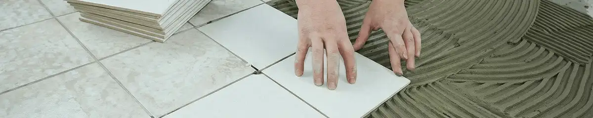 Professional installing white tile floors in Long Beach, CA