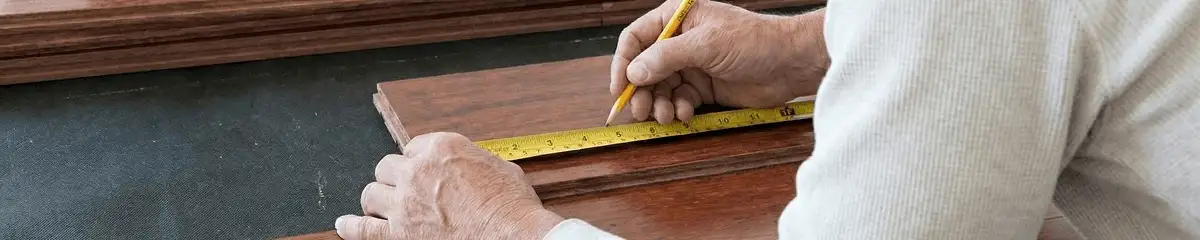 A professional installing wood flooring in Long Beach, CA